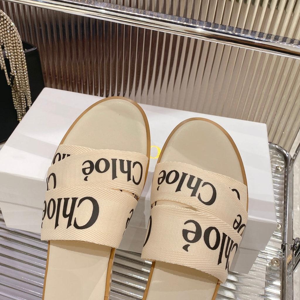 WOODY SLIPPER IN BEIGE MIX BLACK CANVAS