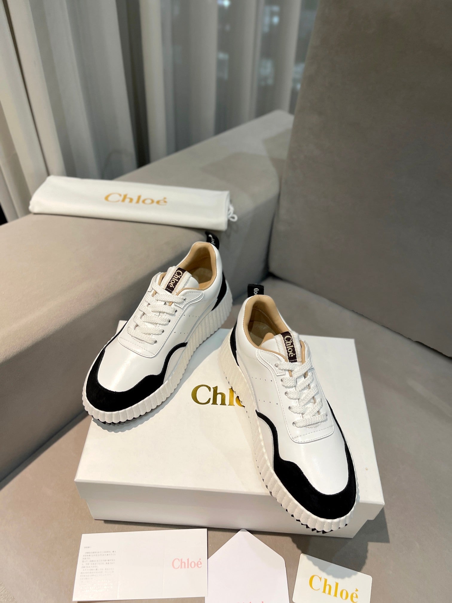 NAMA SNEAKER IN WHITE LAMBSKIN AND BLACK SUEDE