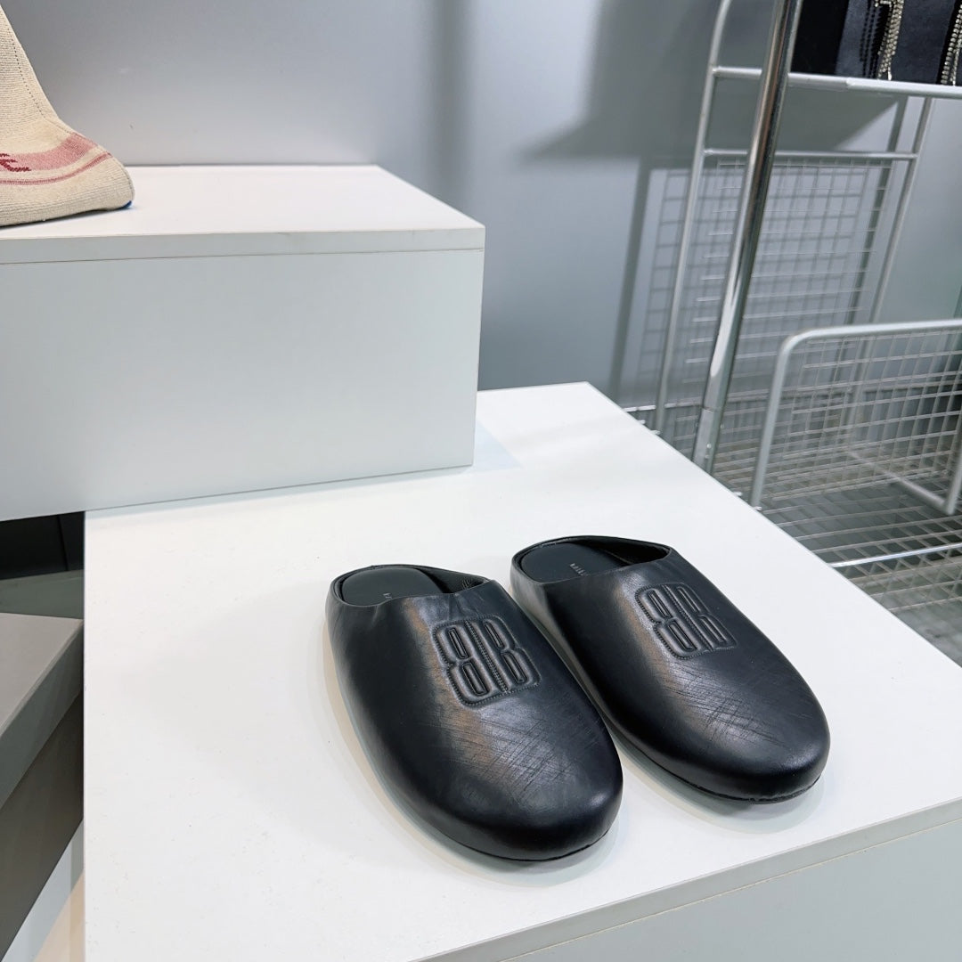 BALENCIAGA 25S MULES IN BLACK LAMBSKIN