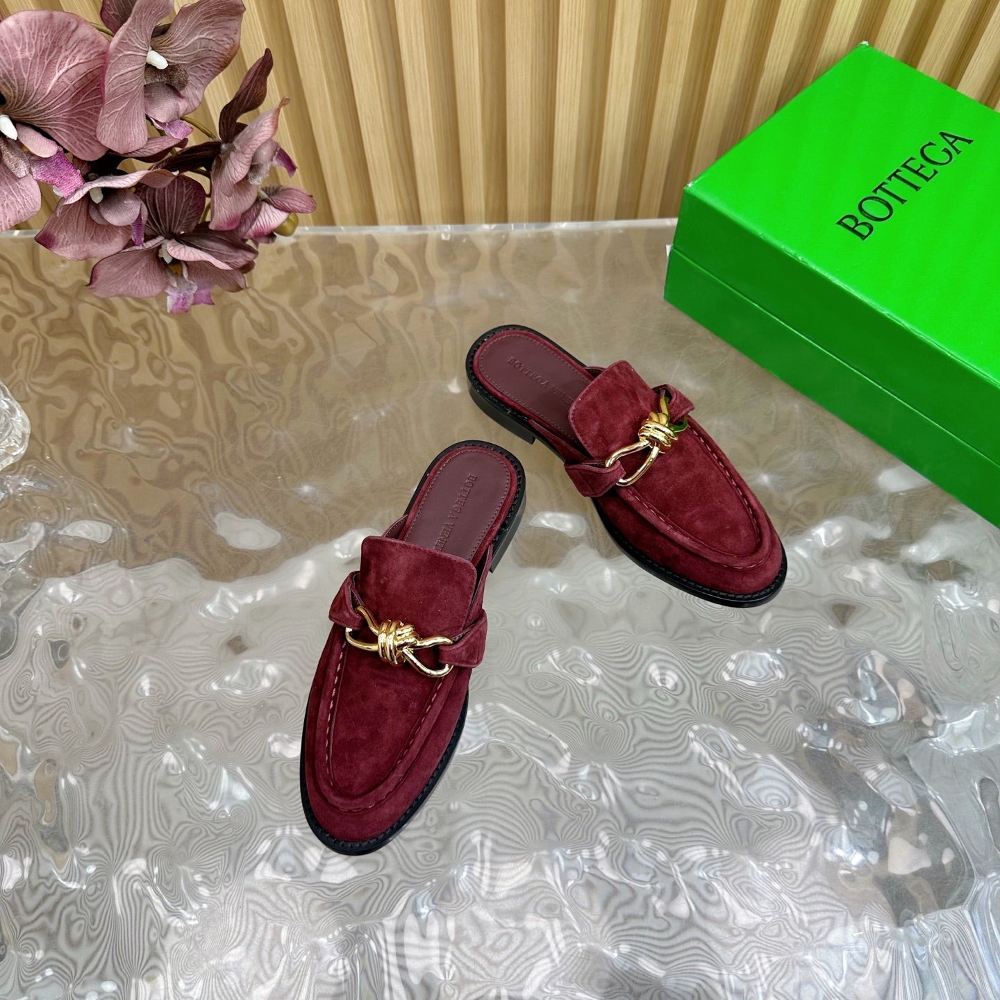 BOTTEGA VENETA OPEN-BACK LOAFER REALISED IN GARNET RED SUEDE WITH SIGNATURE METALLIC KNOT DETAIL