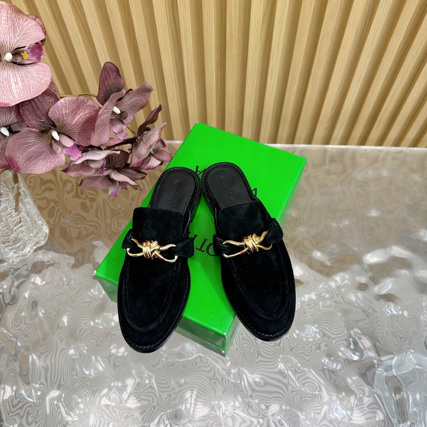 BOTTEGA VENETA OPEN-BACK LOAFER REALISED IN BLACK SUEDE WITH SIGNATURE METALLIC KNOT DETAIL