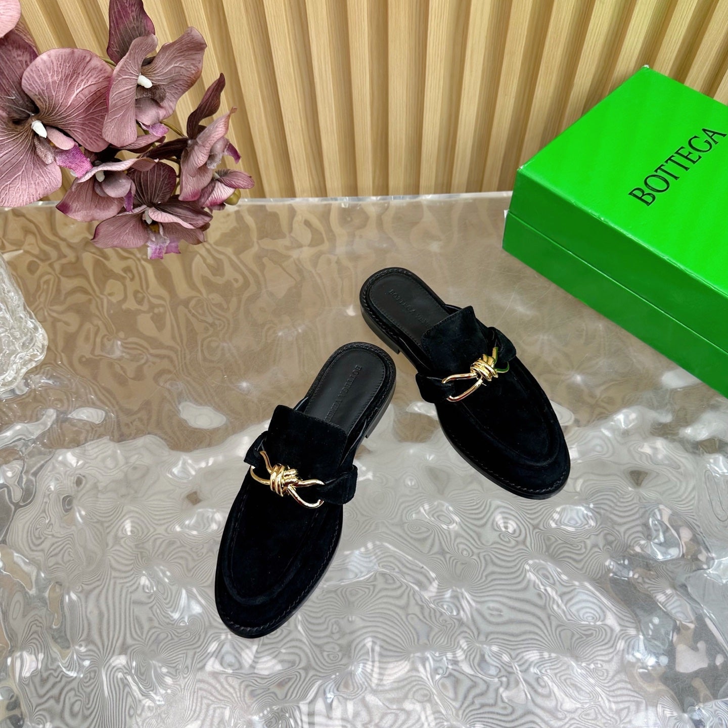 BOTTEGA VENETA OPEN-BACK LOAFER REALISED IN BLACK SUEDE WITH SIGNATURE METALLIC KNOT DETAIL