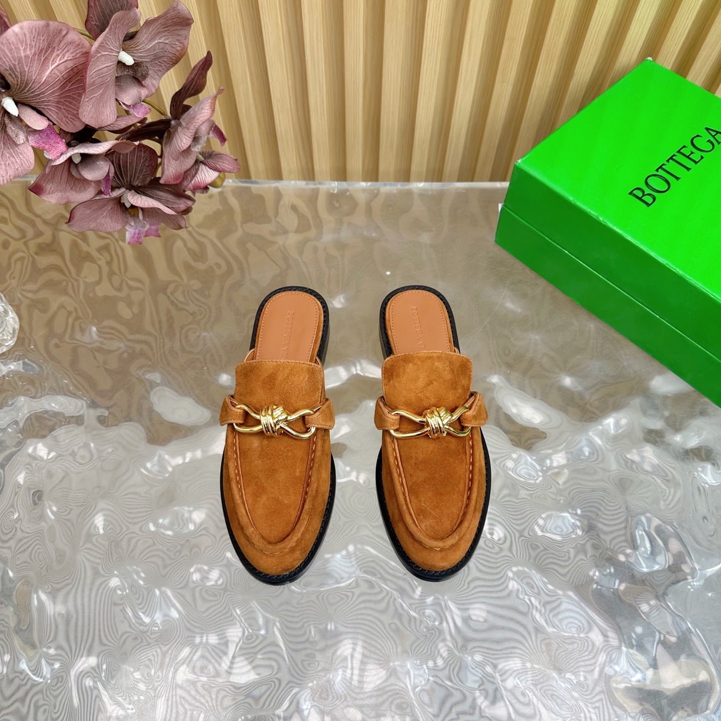 BOTTEGA VENETA OPEN-BACK LOAFER REALISED IN CINNAMON BROWN SUEDE WITH SIGNATURE METALLIC KNOT DETAIL