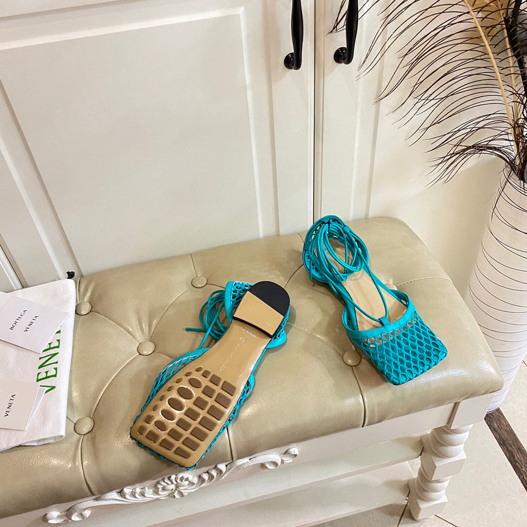 BOTTEGA VENETA STRETCH LACE-UP FLAT SANDAL IN CERULEAN BLUE METALLIZED MESH AND LEATHER