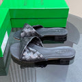 BOTTEGA VENETA BLINK FLAT MULE IN BLACK INTRECCIATO LEATHER