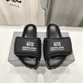 SLIDE SANDALS IN BLACK NYLON AND RUBBER WHITE PRINT